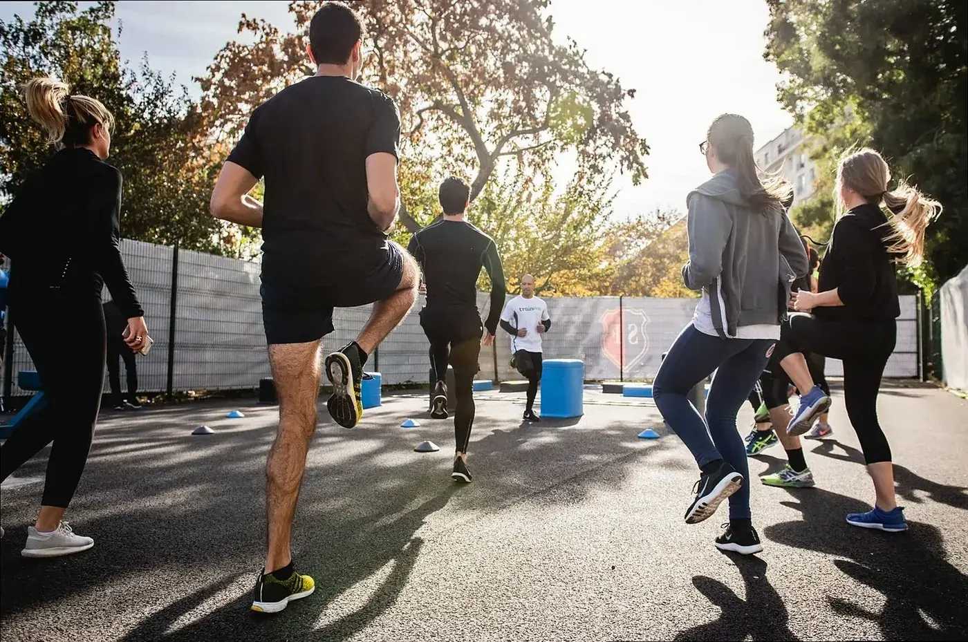 Group class training outdoors on a sunny morning