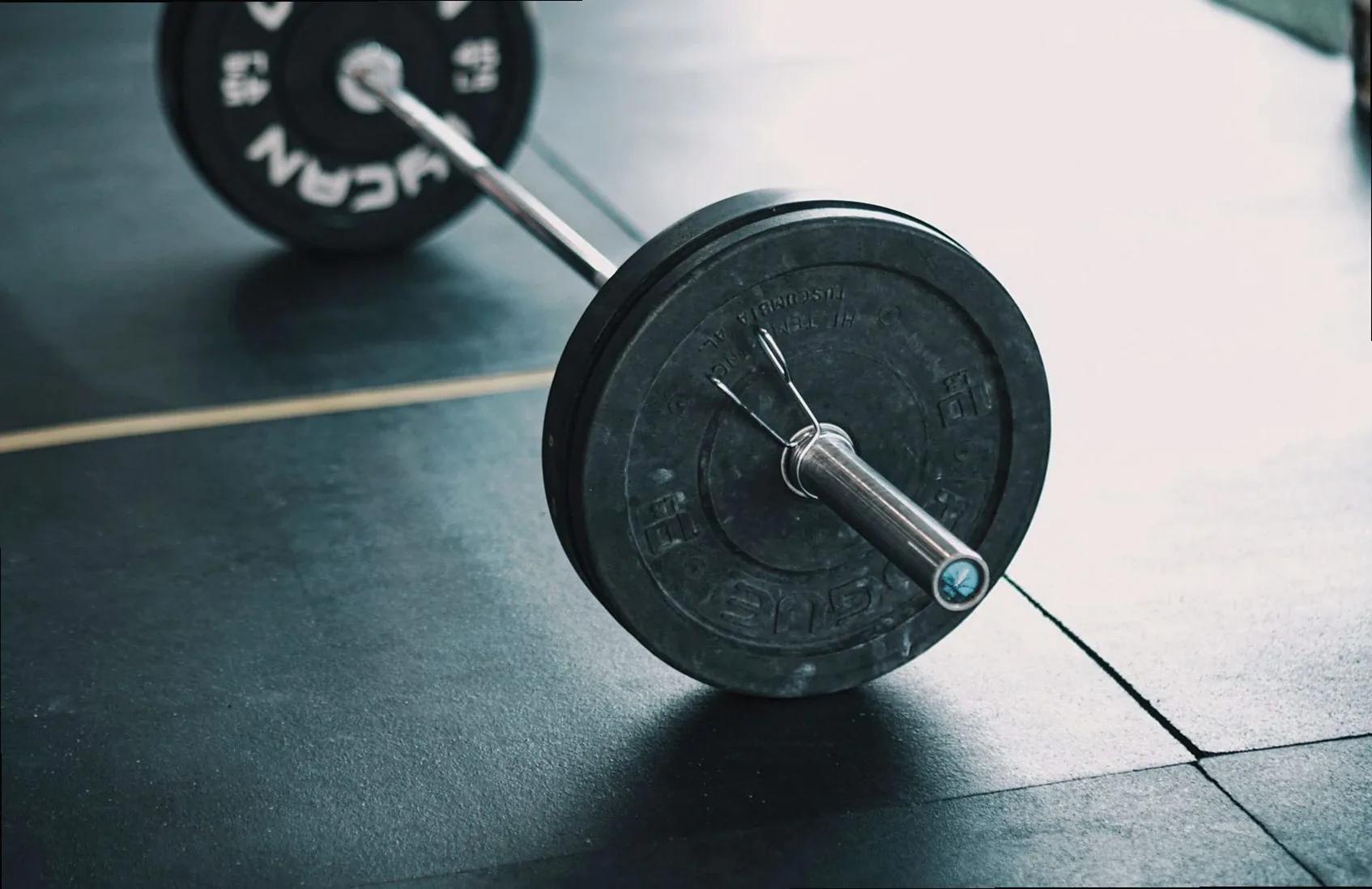 Loaded barbell resting on the lifting platform